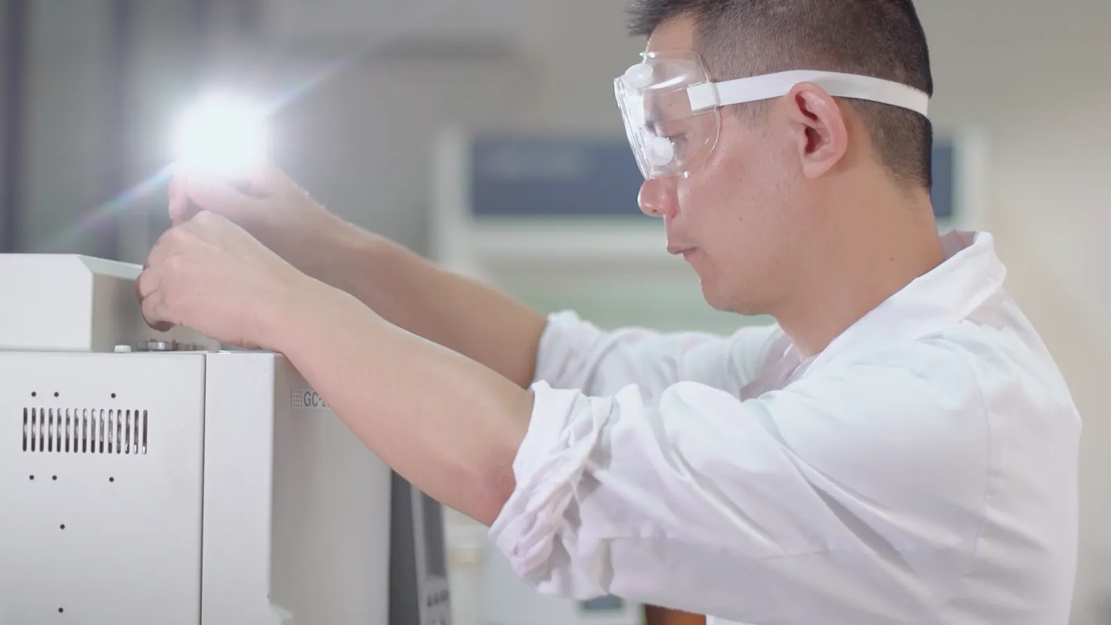 Quality control technician checking cyanoacrylate adhesive production records